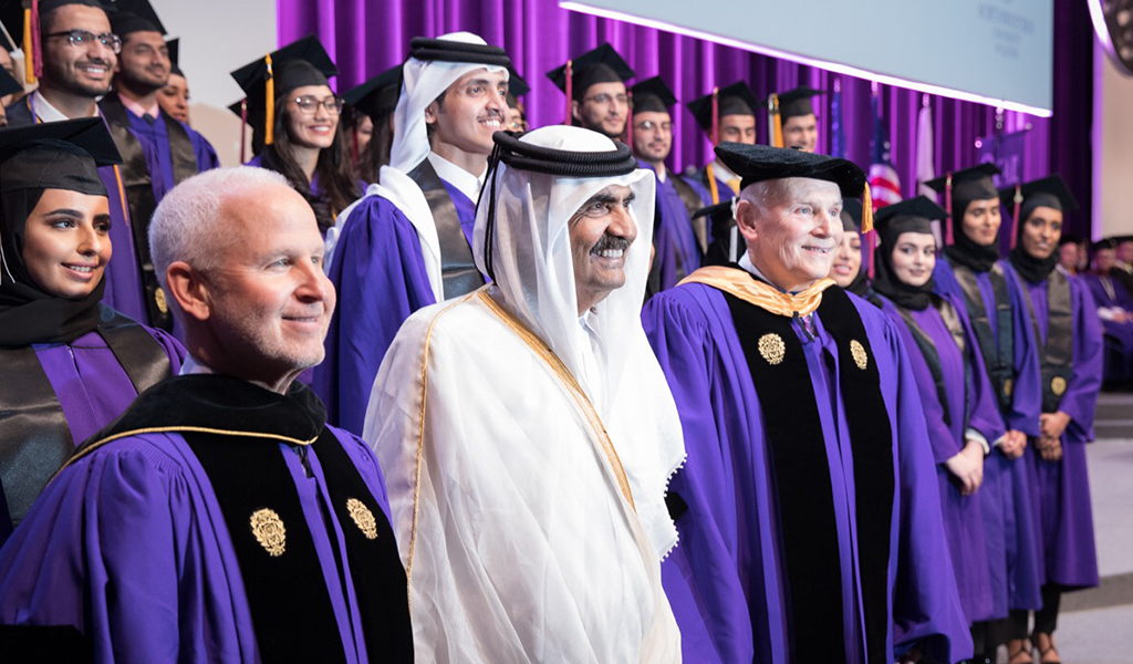 His Highness Sheikh Hamad bin Khalifa Al Thani, the Father Emir of Qatar (pictured centered); Morton Schapiro, president of Northwestern University (pictured left); and Everette E. Dennis, dean and CEO of NU-Q (pictured right), with the Class of 2017. Photo provided by the Emiri Diwan.