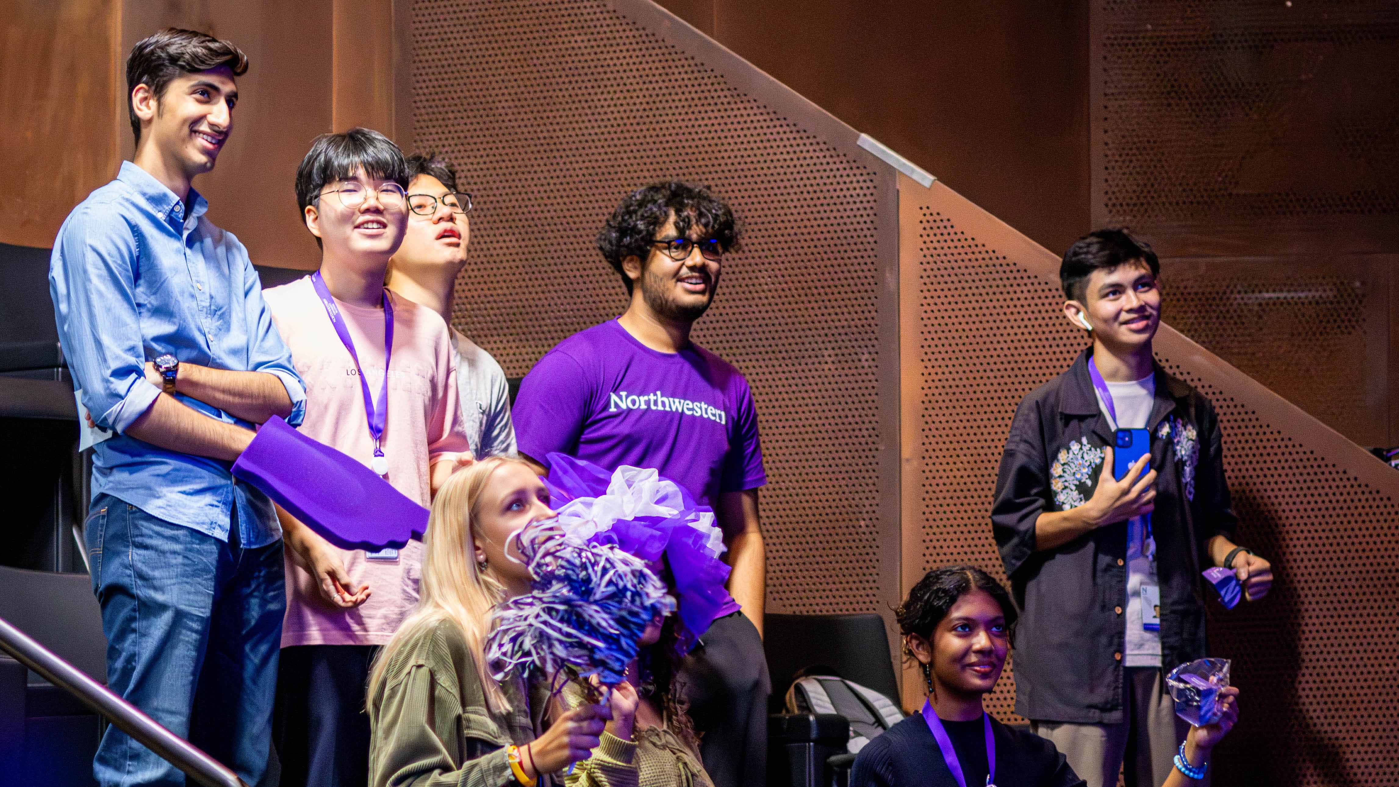 New students holding Northwestern Qatar merch as they participate in community building activities