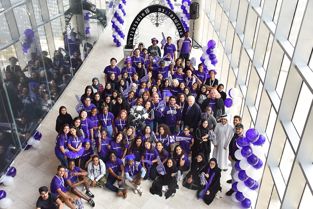 NU-Q’s incoming class of 123 students join Dean Everette E. Dennis after participating in Northwestern’s "March Through the Arch" tradition. 