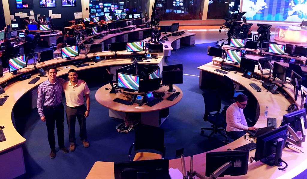 Pictured left: Tal Axelrod and Brandon Wilson at the Al Jazeera English news studio in Doha