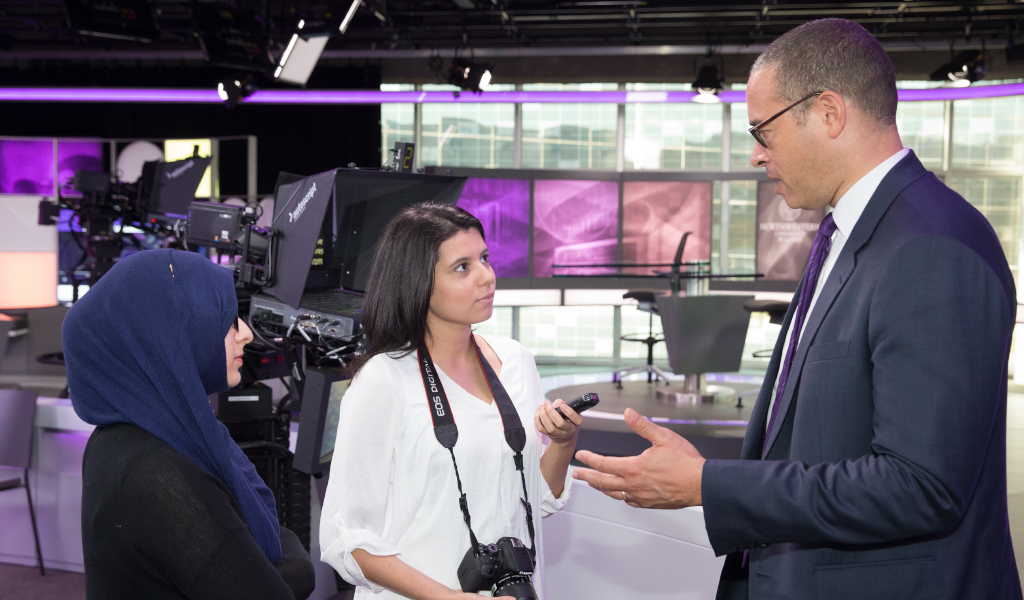 Northwestern University Provost Jonathan Holloway speaks to student reporters from The Daily Q about the opening of NU-Q's newsroom.