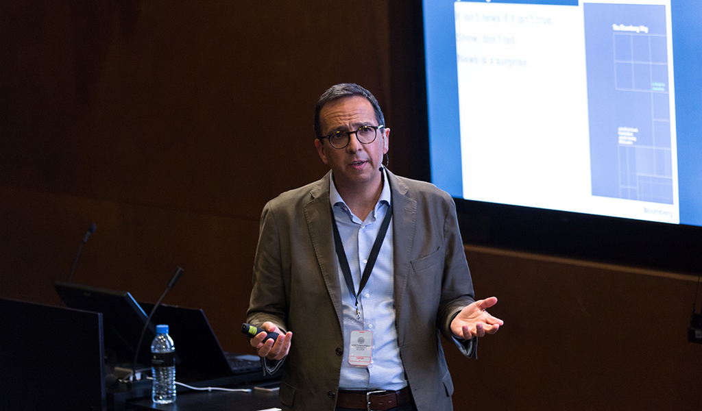 Riad Hamade, executive editor of Bloomberg News MENA, presenting on financial information and reporting at Northwestern University in Qatar.