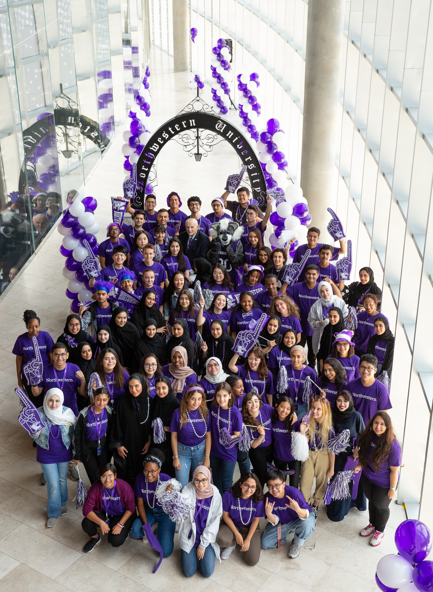 At the end of a busy orientation week, NU-Q’s Class of 2022 joins Dean Everette E. Dennis at NU-Q’s Arch.