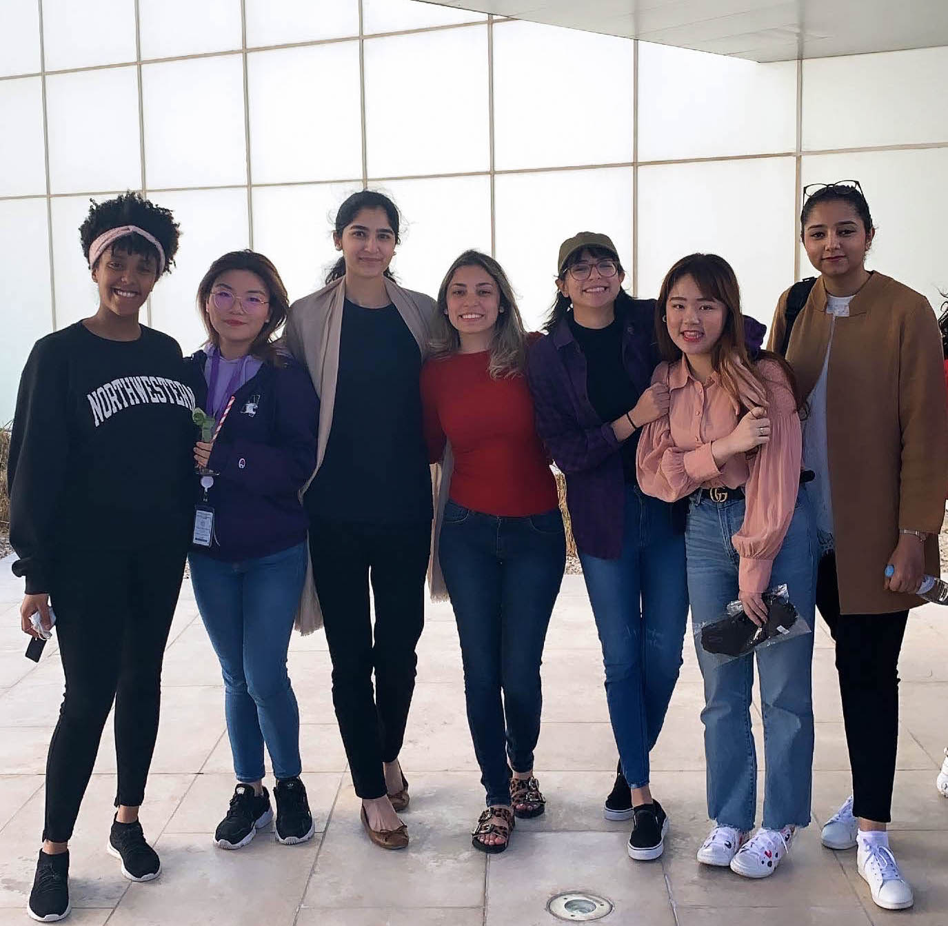 From left to right: NU-Q students Eden Wagari, Haowen Xue, Areesha Lodhi, Letícia Bila, Fatma Oueslati, Lingyu Feng, and Zeest Marrium. 